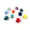 A set of ten glossy, five-pointed star beads in various colors, including red, yellow, blue, green, purple, and orange, arranged on a plain white background.