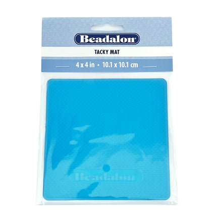 A blue square tacky mat in clear plastic packaging with a light blue header card. The header card has the Beadalon brand logo and text reading 'TACKY MAT' with dimensions '4 x 4 in (10cm x 10cm)'.