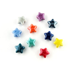 Ten small glossy star-shaped beads in assorted colors, including white, purple, blue, orange, dark blue, teal, red, and yellow, arranged on a plain white background.