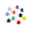 Ten small glossy star-shaped beads in assorted colors, including white, purple, blue, orange, dark blue, teal, red, and yellow, arranged on a plain white background.