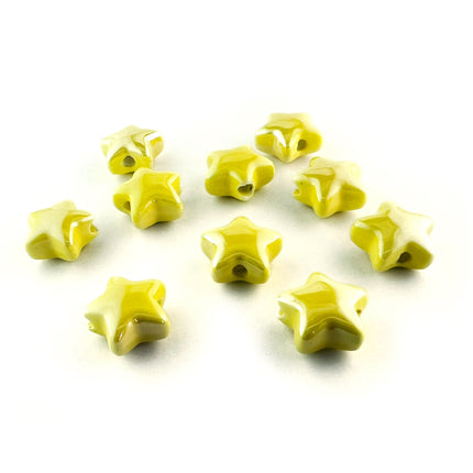 Ten small glossy star-shaped beads in a vibrant yellow colour, arranged on a plain white background.