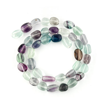 A strand of polished tumbled gemstone beads in a multicolor mix of purple, green, blue, gray, and brown, arranged in a circle on a white background.