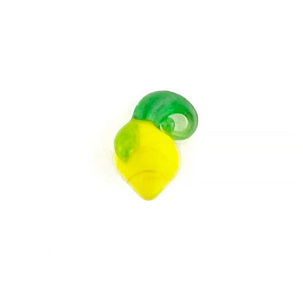 A small translucent bead or charm shaped like a lemon, featuring a bright yellow body and a green stalk that dougles at a bail, shown on a plain white background.