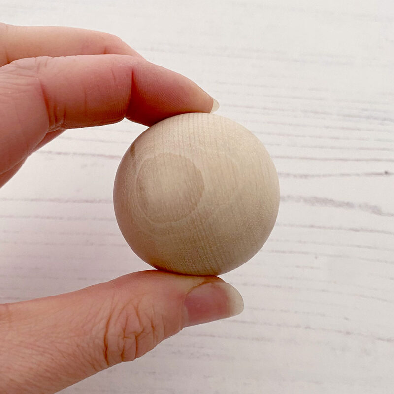 40mm wooden bead in hand