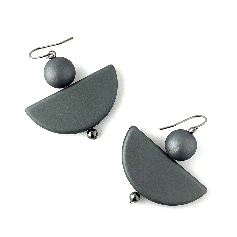 rubberised acrylic earrings in dark grey. 12mm beads sat on top of a larger flat semi circular beads. They threaded on head pins and made into earrings.